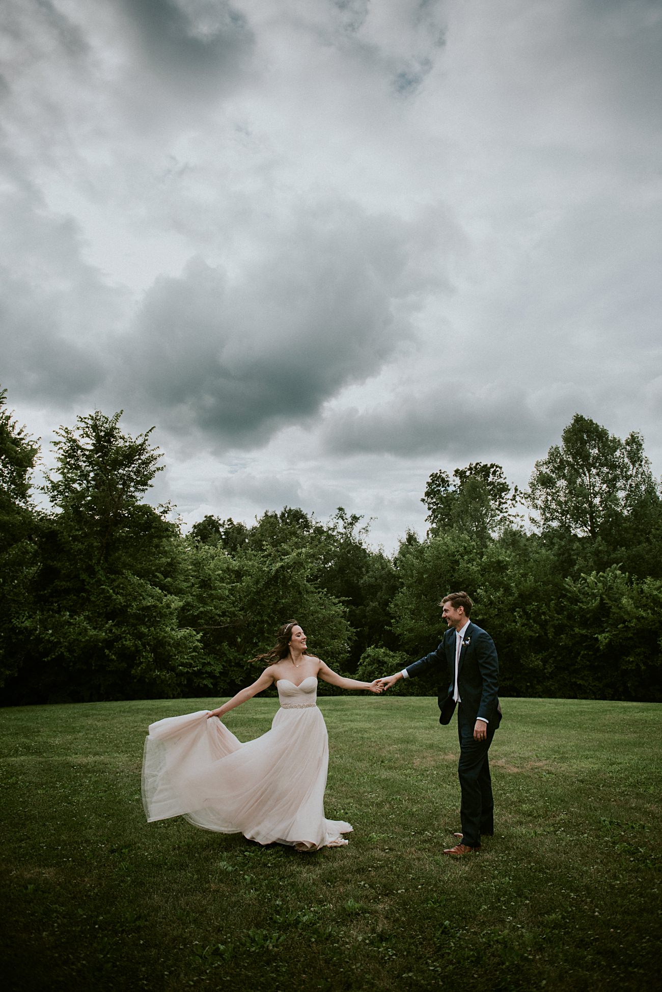 Bride and Groom Photos, Couples photos on wedding days, Stormy sky's, Blush wedding gown, Backyard Hilltop Wedding in Spring Green Wisconsin, Madison WI Wedding Photographer